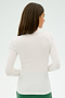 A woman with long brown hair, wearing the SPLITS59 Louise Rib Long Sleeve in white paired with green pants, stands in a yoga pose against a light background.