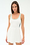 A woman wears the SPLITS59 Martina Rigor Color Block Dress in White/Spearmint, styled for high-impact workouts or court sports, standing against a plain white background.