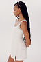 A person with long braided hair wearing a white sleeveless Martina Rigor Dress w/Piping - White from SPLITS59 stands against a plain white background, looking to the side.