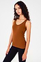 Side view of girl wearing a reddish brown tank top and black leggings