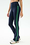 A person wears SPLITS59 Raquel High Waist Flared Legging in Indigo/Grass with white sneakers, ideal for workouts thanks to 4-way stretch fabric, standing against a plain light background.