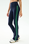 A person wears SPLITS59 Raquel High Waist Flared Legging in Indigo/Grass with white sneakers, ideal for workouts thanks to 4-way stretch fabric, standing against a plain light background.