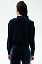 A person with long dark hair, seen from behind, wears the SPLITS59 Heritage Velour Bomber in Indigo/Grass—ideal for yoga—against a plain light background.