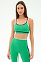 A woman wears the SPLITS59 Eva Rigor Double Strap Bra in Spearmint/Indigo and high-waisted leggings, standing against a plain light background.