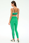 A woman, seen from the back on a white background, models SPLITS59's Sam High Waist Rigor 7/8 leggings in Spearmint/Indigo, featuring black and white stripes and crafted from Rigor fabric.