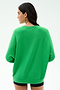 Woman with long dark hair faces away, wearing the SPLITS59 Andie Oversized Fleece Varsity Graphic Sweatshirt in Grass and dark shorts against a white background. This crewneck pullover is made in Los Angeles.
