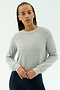 A person with braided hair wears the SPLITS59 Brooks Fleece Long Sleeve Sweatshirt in Heather Grey and black pants, standing against a plain white background.