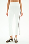 A person wears SPLITS59 Raquel High Waist Supplex Crop pants in White/Dark Chocolate and brown-and-white Nike sneakers, standing against a plain background.