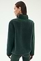 A woman stands with her back turned, wearing the SPLITS59 Harris Sherpa Jacket in Military/Indigo and green leggings against a plain light background.