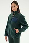 A woman wears the SPLITS59 Harris Sherpa Jacket in Military/Indigo, featuring a zippered navy chest pocket, along with matching pants, standing against a plain light background.