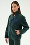 A woman wears the SPLITS59 Harris Sherpa Jacket in Military/Indigo, featuring a zippered navy chest pocket, along with matching pants, standing against a plain light background.