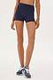 A woman wearing a blue SPLITS59 Airweight High Waist 3.5” Short - Indigo sports short.