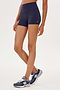 A woman wearing a SPLITS59 Airweight High Waist 3.5” Short designed for Pilates.