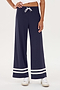 A woman wearing a SPLITS59 Quinn Airweight Wide Leg Pant in Indigo with white stripes for yoga comfort.