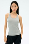 A woman wearing the Splits59 Ashby Rib Tank in Lt. Heather Grey and black pants stands against a plain light background, facing forward with a neutral expression.