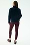 A person faces away, wearing the SPLITS59 Harris Sherpa Jacket in Indigo/Dark Cherry, paired with burgundy leggings and sneakers, set against a plain light background.