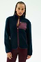 A woman with braided hair wears the SPLITS59 Harris Sherpa Jacket in Indigo/Dark Cherry, featuring a maroon chest pocket, along with maroon leggings, standing against a plain light background.