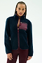 A woman with braided hair wears the SPLITS59 Harris Sherpa Jacket in Indigo/Dark Cherry, featuring a maroon chest pocket, along with maroon leggings, standing against a plain light background.