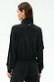 A woman with straight brown hair is seen from the back wearing the SPLITS59 Peaches Airweight Cargo Jacket in black against a plain light background.