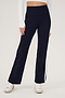 The model is wearing SPLITS59's Harper Supplex Pant in Indigo/White and a white crop top, perfect for a workout.