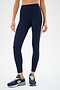 A person wears SPLITS59's Clare High Waist Rigor 7/8 in Indigo/White, ideal for gym sessions, stylishly paired with dark blue sneakers.
