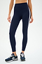 A person wears SPLITS59's Clare High Waist Rigor 7/8 in Indigo/White, ideal for gym sessions, stylishly paired with dark blue sneakers.
