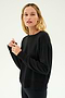 A person is wearing the SPLITS59 Sonja Fleece Sweatshirt in black, paired with black pants against a plain white background.