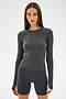 Against a light gray background, a person wears the SPLITS59 Airweight Lite LS Waist Length in Graphite with matching shorts, ideal for quick-dry gym workouts.