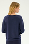 A woman with blond hair, seen from behind, wears the SPLITS59 Sonja Fleece Sweatshirt in Indigo—a loose-fitting, long-sleeve crewneck made in Los Angeles—against a plain light background.