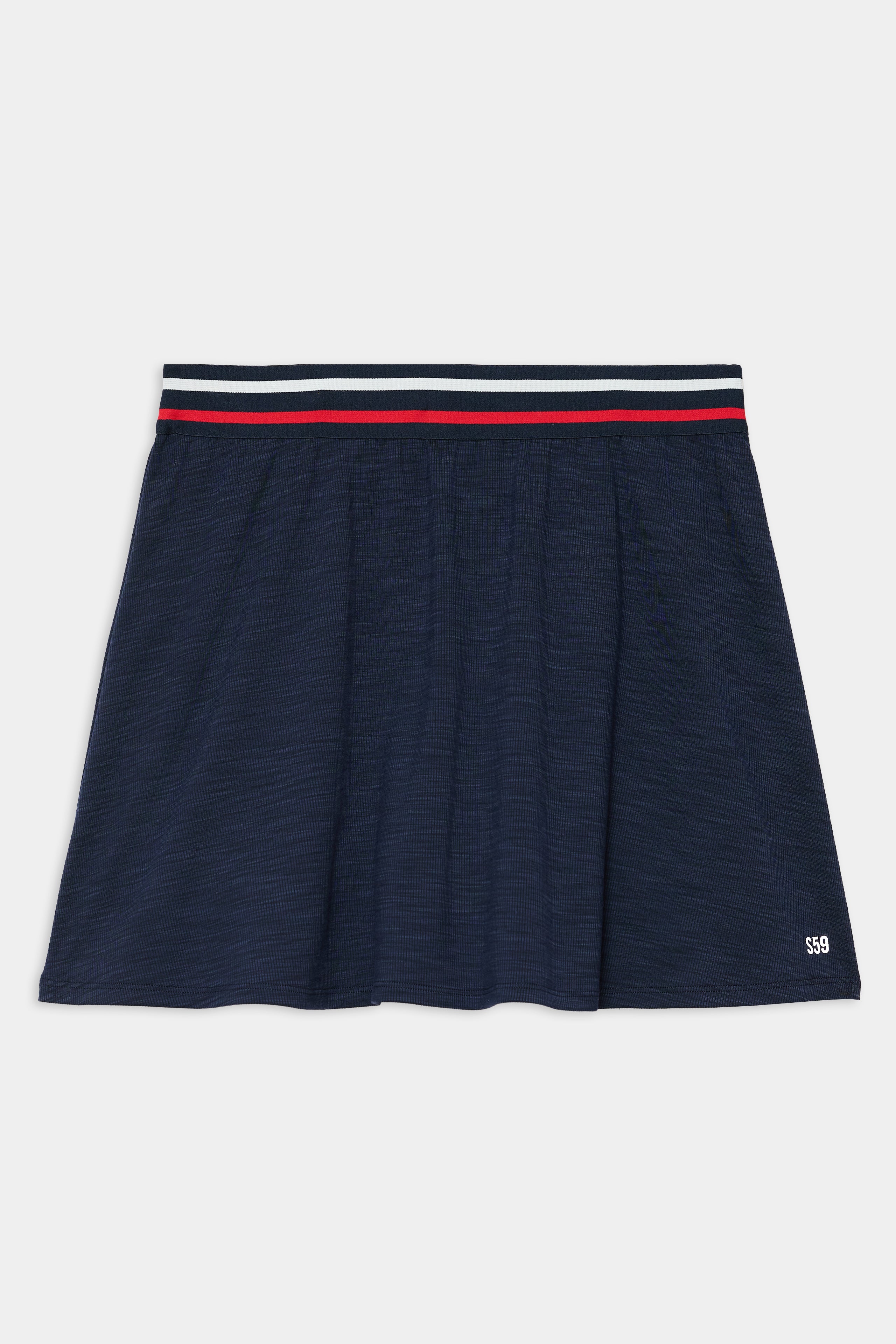 The SPLITS59 Kaia Active Rib Skort in Heather Indigo features a sporty white and red striped waistband and subtle "SS9" text near the hem.