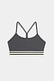The Cali Active Rib Bra by SPLITS59 features a gray ribbed design, thin shoulder straps, a racerback, and a white-and-black striped elastic band at the bottom.