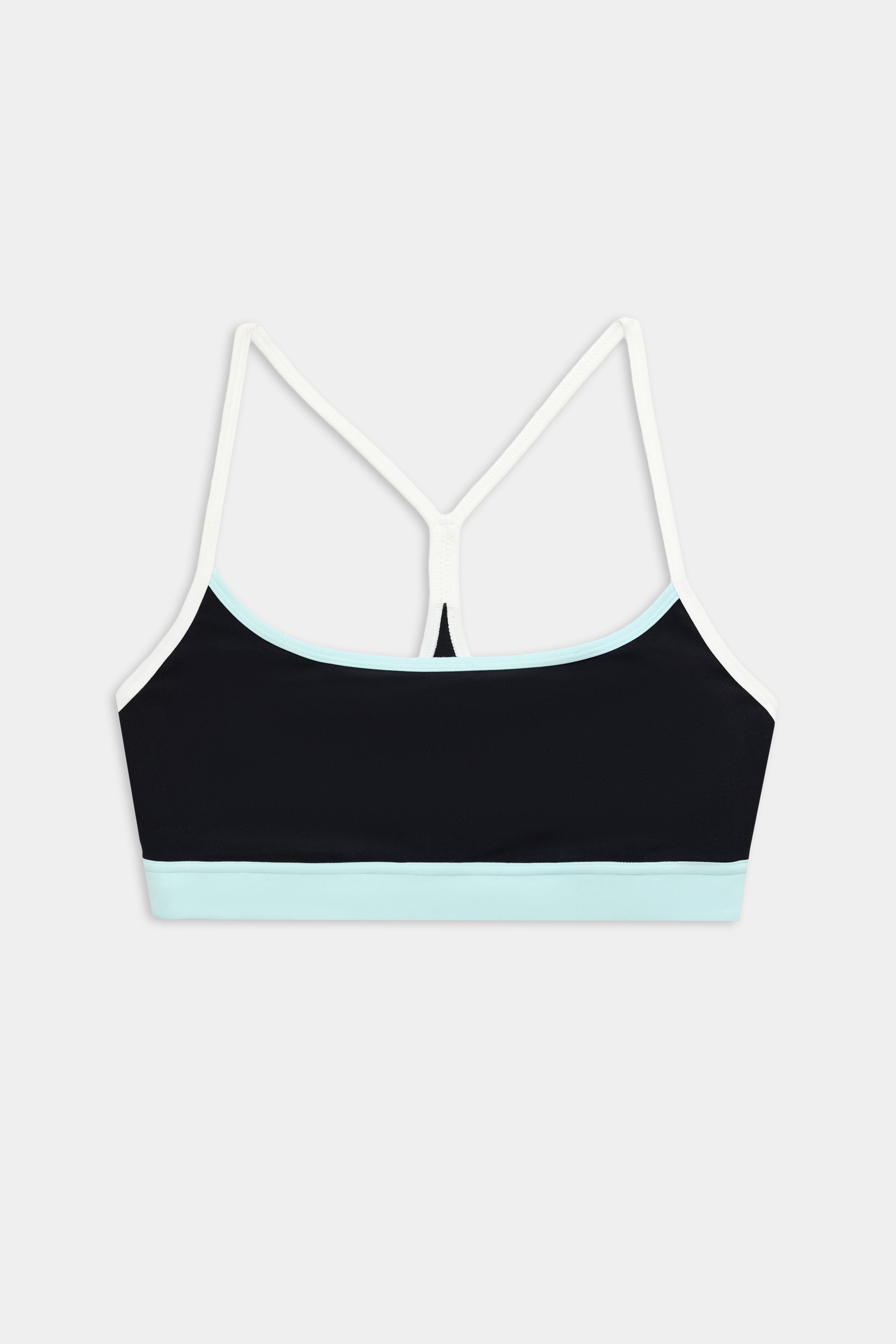 The SPLITS59 Emerson Airweight Bra in Black/Ice features thin white straps and a light blue band, ideal for Pilates or hot yoga. Shown against a plain white background.
