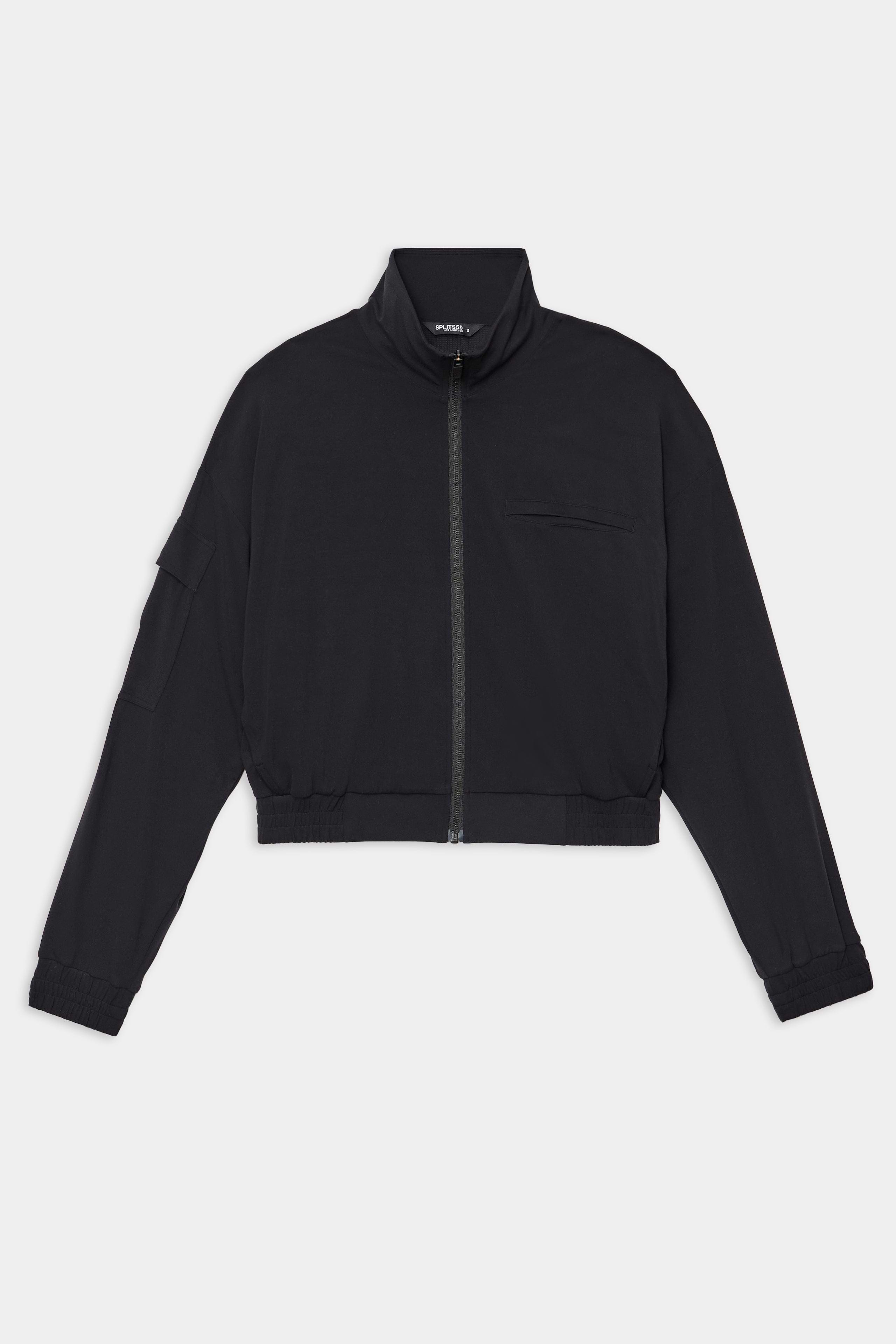 The SPLITS59 Peaches Airweight Cargo Jacket in black is a long-sleeve, zip-up cropped jacket with a stand collar and elastic cuffs, crafted from stretchy nylon-spandex athletic fabric and shown on a plain white background.