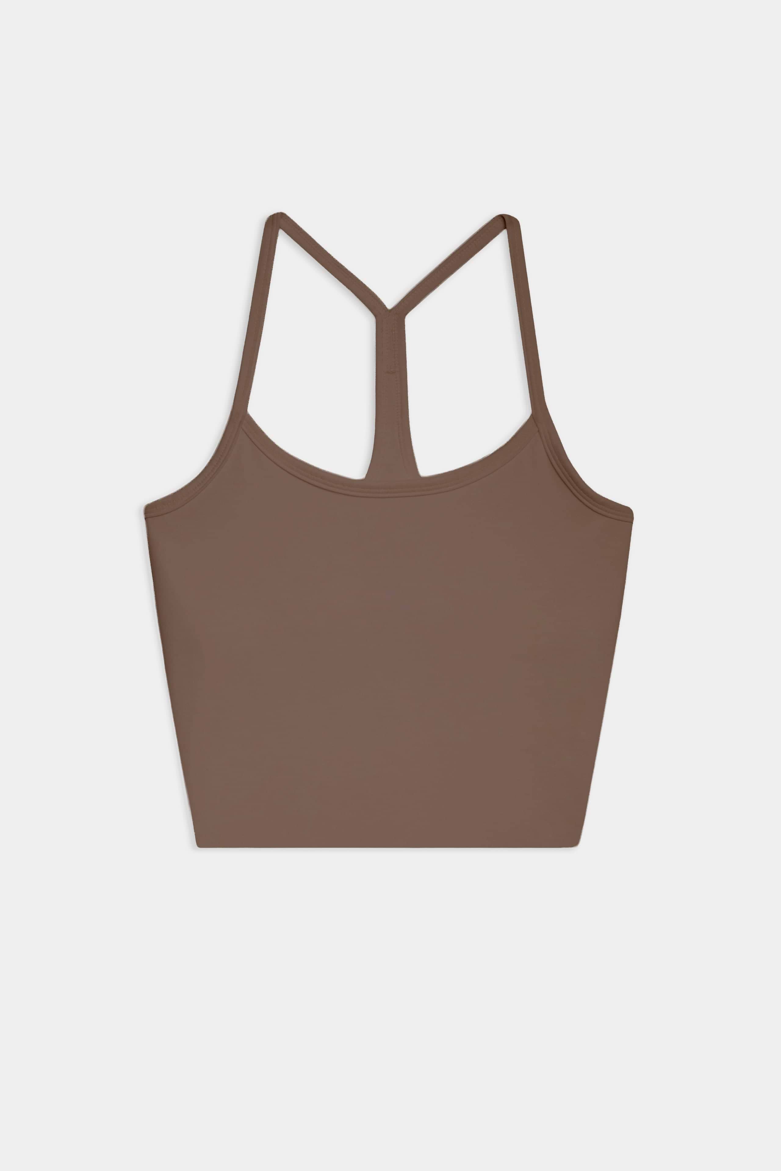 The SPLITS59 Airweight Crop - Lentil is a brown racerback tank with thin straps, ideal for hot yoga. Shown laid flat on a white background.