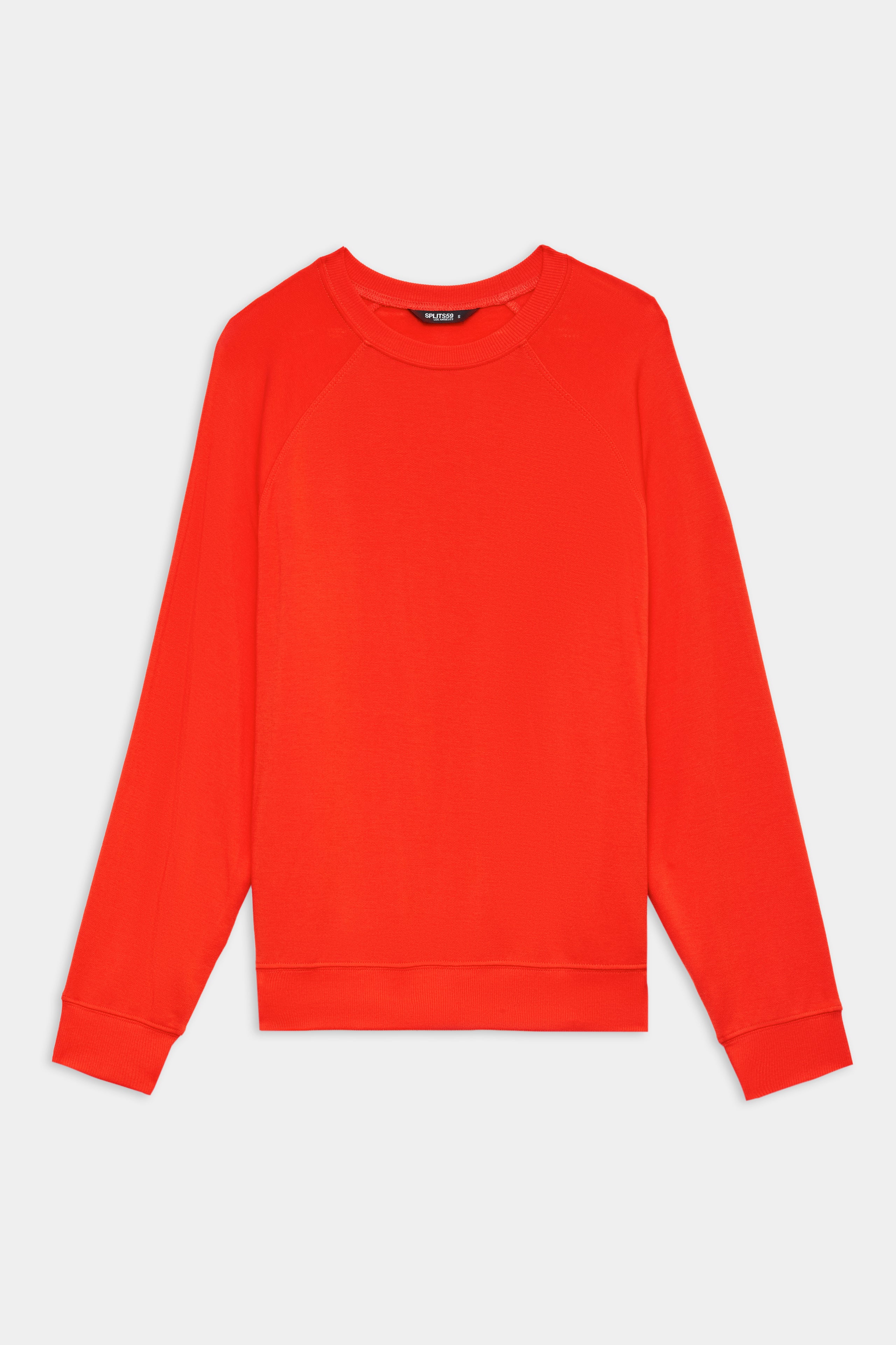 The SPLITS59 Andie Oversized Fleece Sweatshirt in Lotus Red, made from soft stretch modal fabric, is displayed flat on a white background.