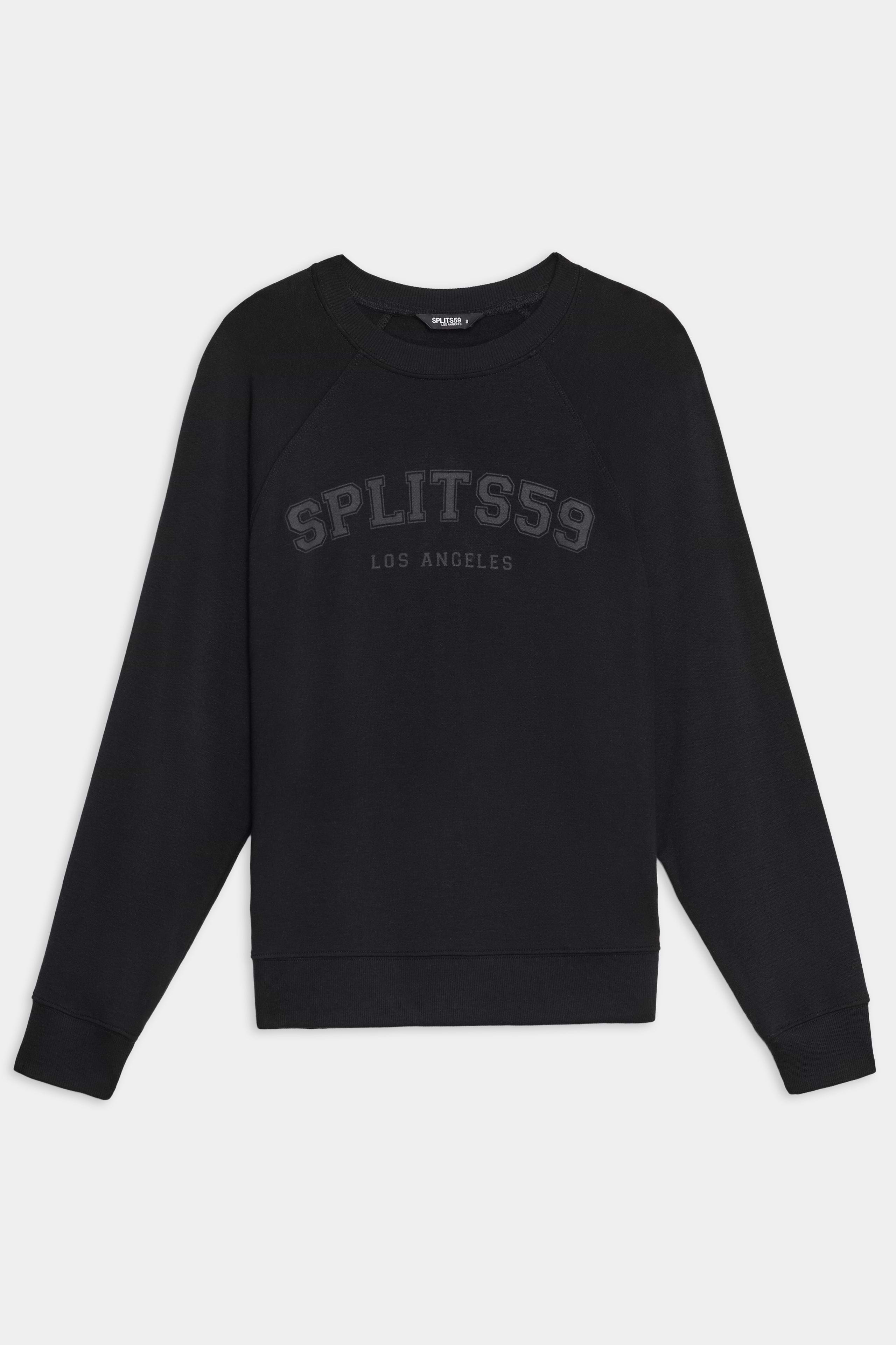 The SPLITS59 Andie Oversized Fleece Varsity Graphic Sweatshirt in black features "SPLITS59 LOS ANGELES" text on the front, made from soft fleece, shown on a plain white background.