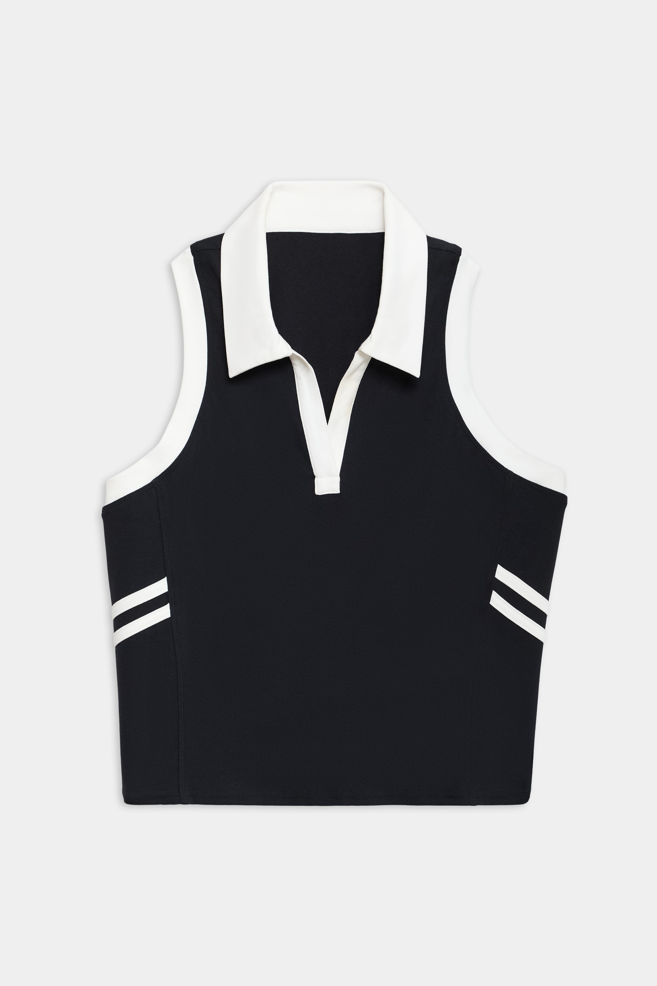The SPLITS59 Austin Airweight Crop Polo is a sleeveless black top with a white collar, V-neck, and two white stripes near the hem on each side.