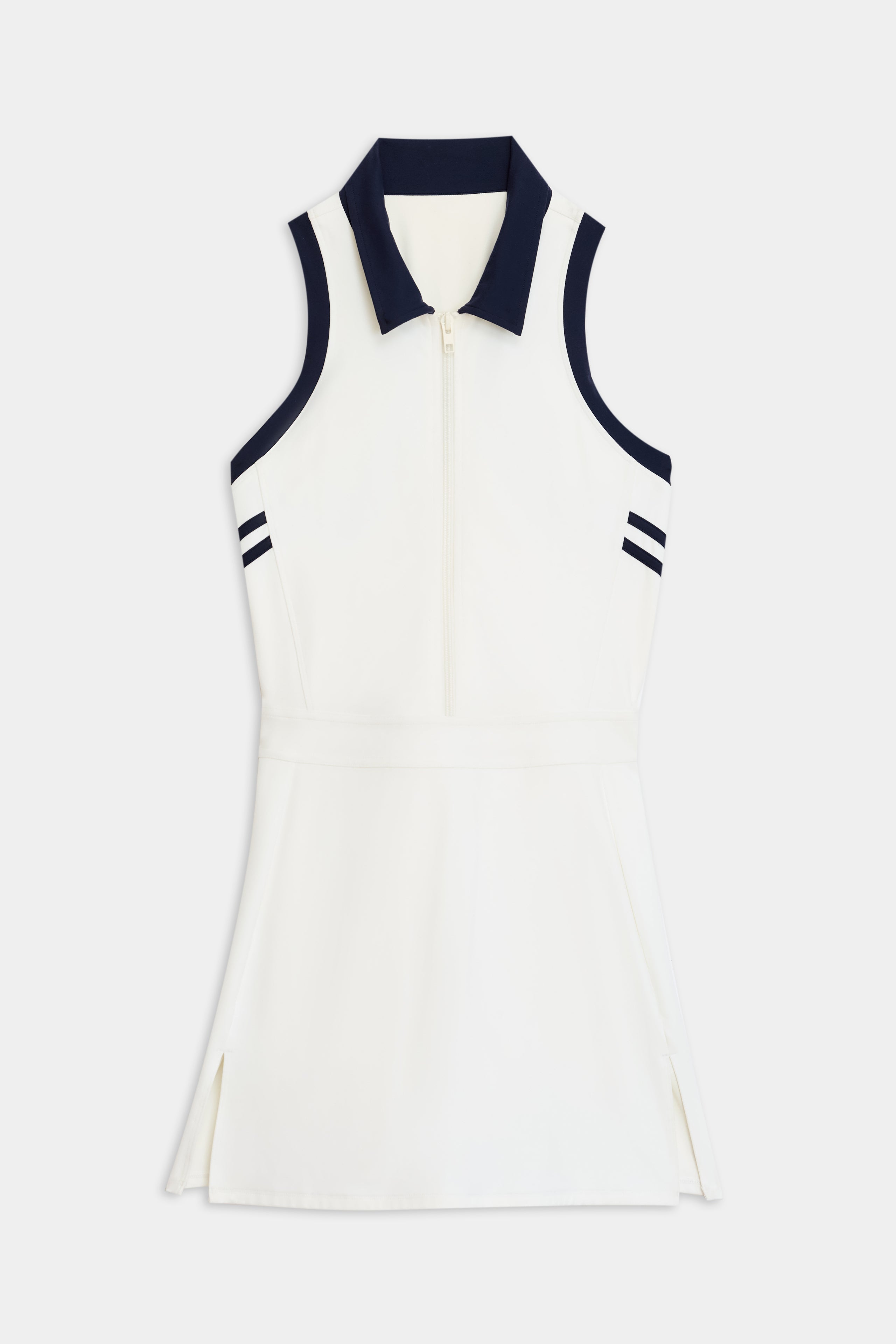 The Austin Rigor Dress by SPLITS59 is a white sleeveless dress featuring a navy collar, dual striped accents on each shoulder, a front zipper, and slight side slits.