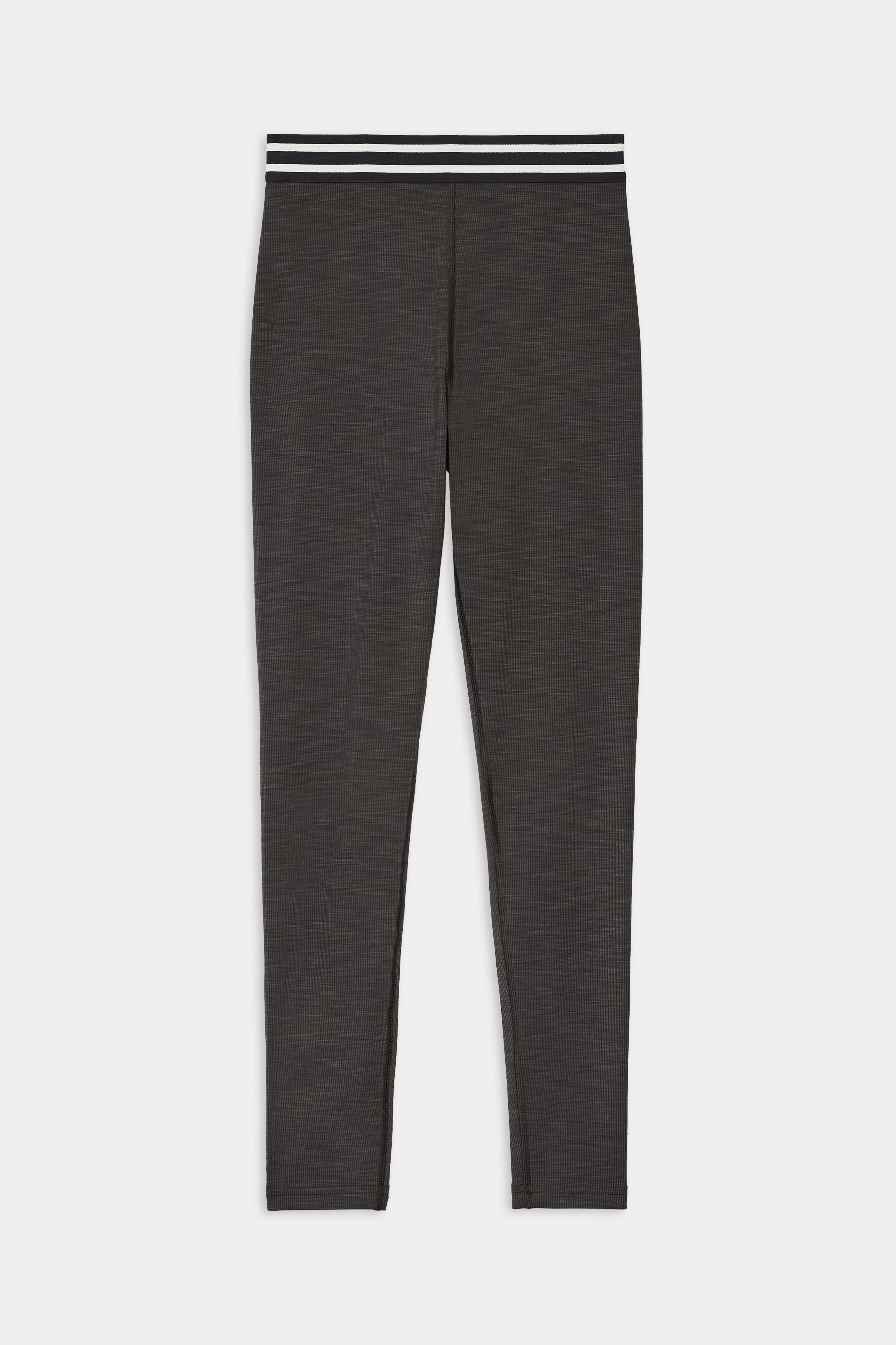 The SPLITS59 Bailey Active Rib High Waist 7/8 leggings in Heather Graphite feature a black-and-white striped elastic waistband and are shown laid flat on a white background.