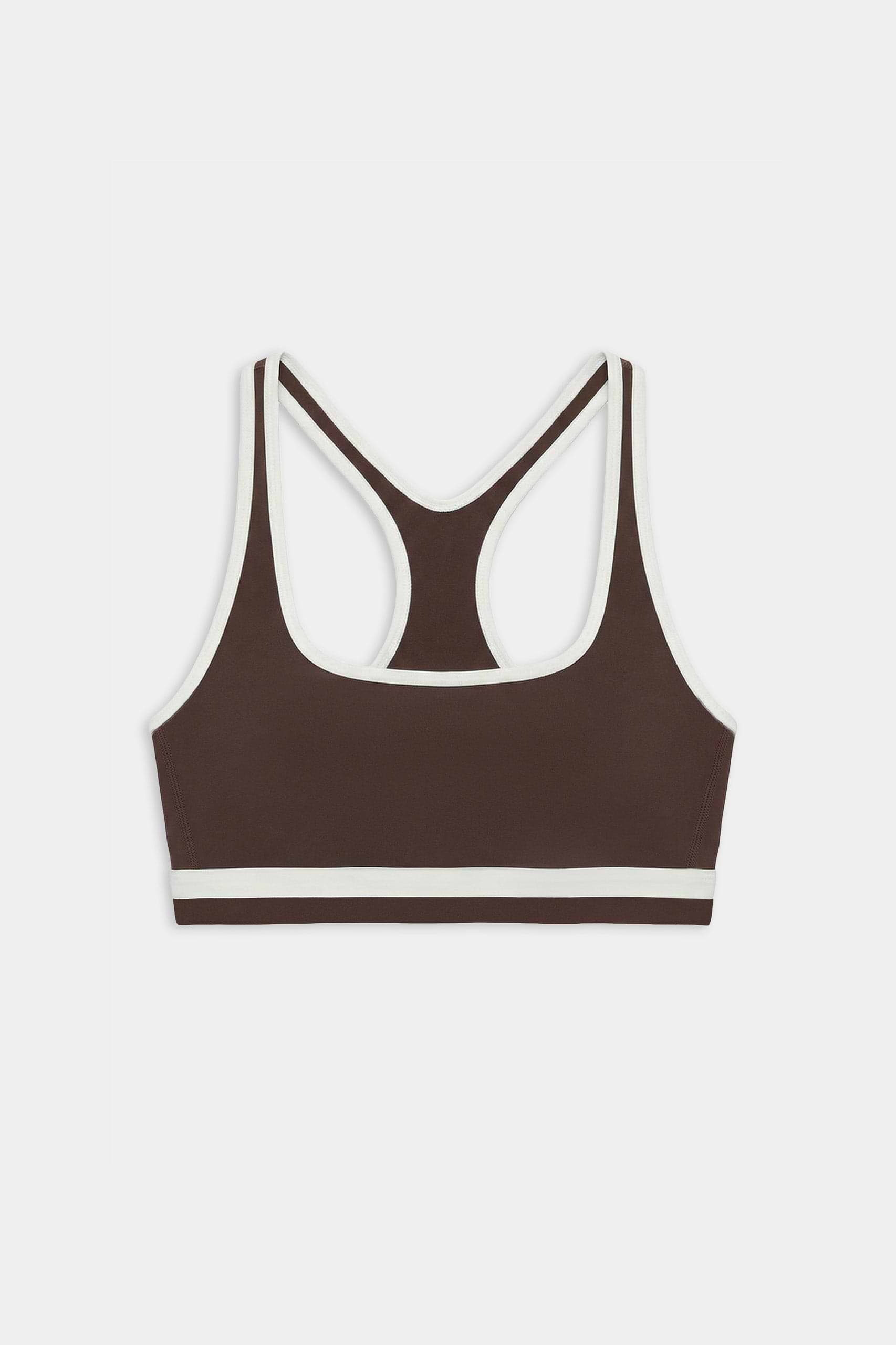 The SPLITS59 Bianca Rigor Bra in Dark Chocolate/White features a racerback design with white trim, made from stretchy nylon spandex, displayed on a white background.