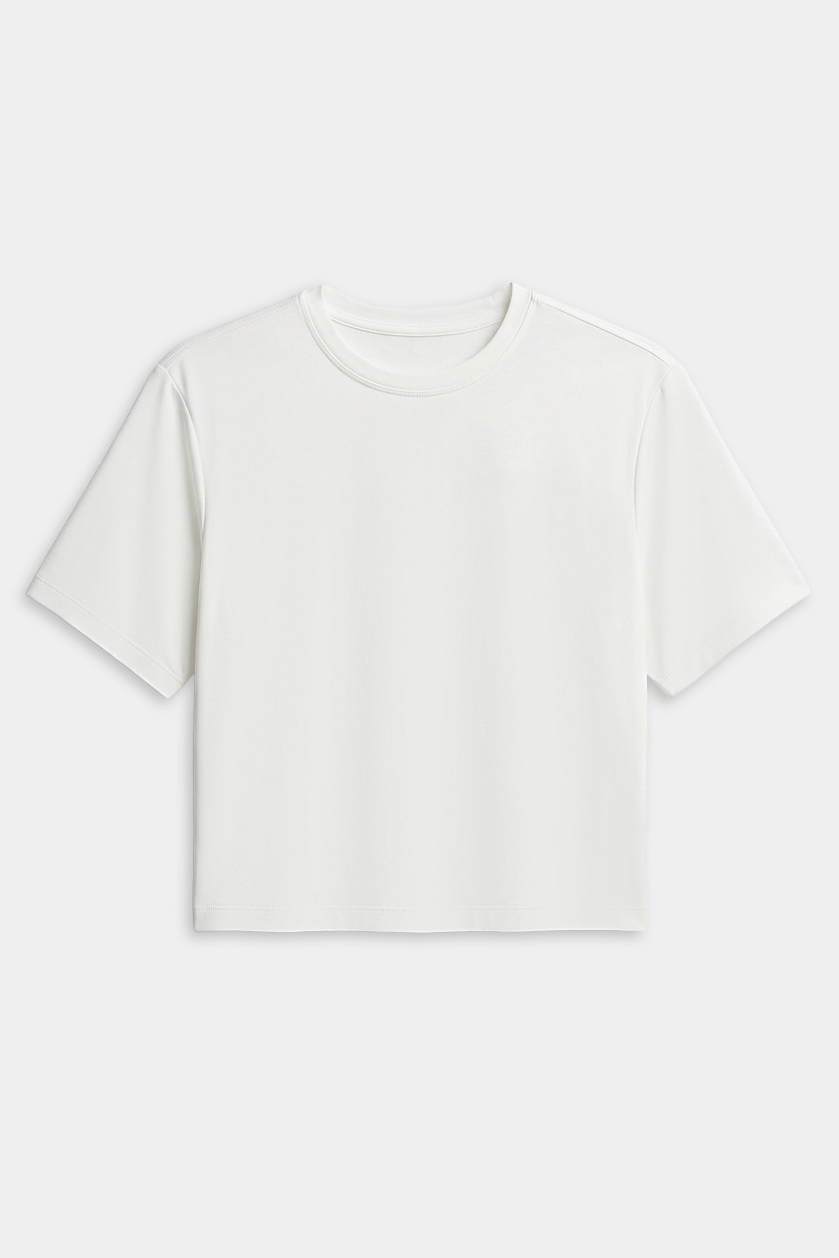 The SPLITS59 Djuna Oversized Jersey Tee in white features a short-sleeve, crew neck design—ideal for gym or outdoor workouts. Shown laid flat on a white background.