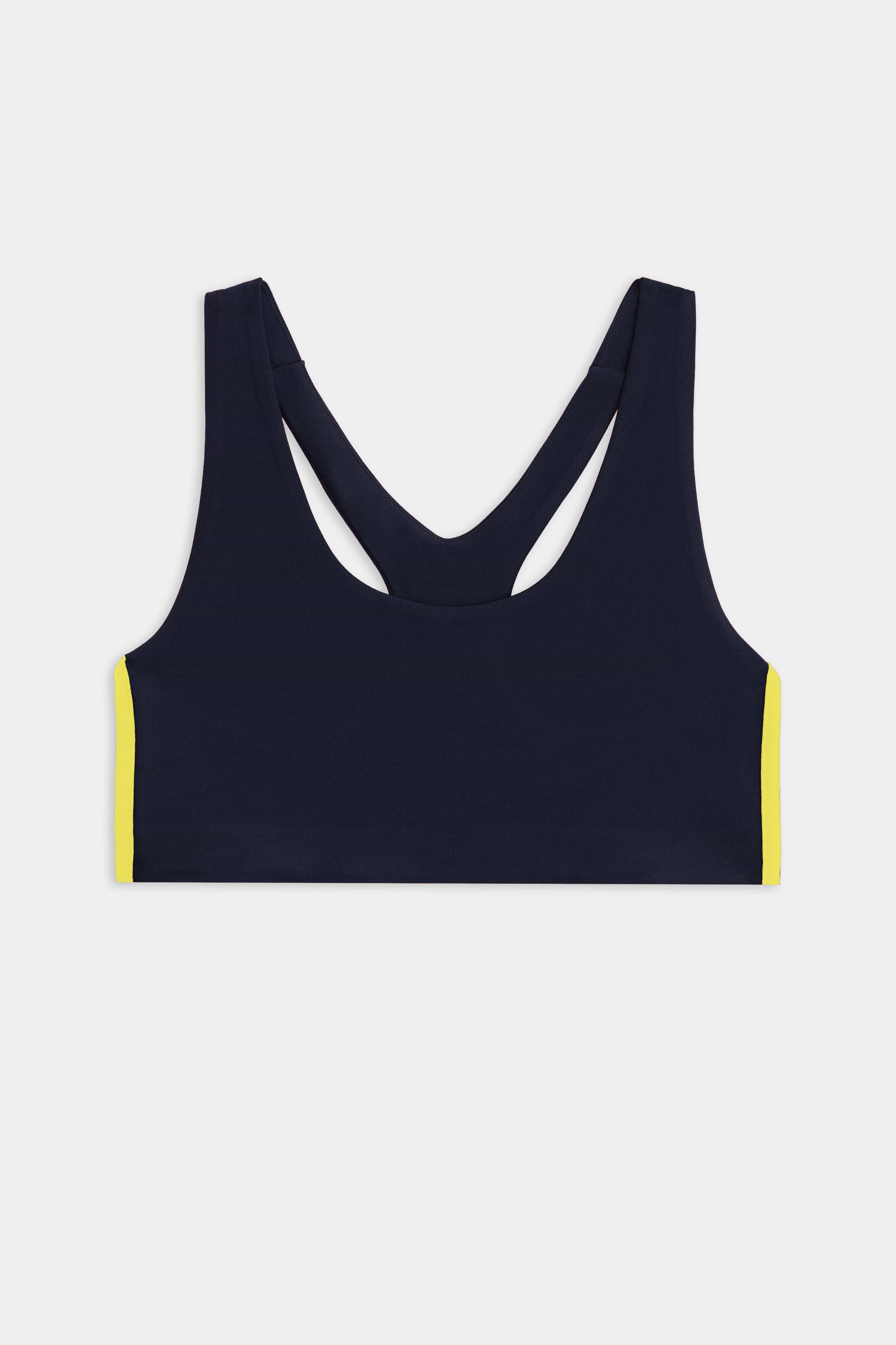 The SPLITS59 Ella Airweight Bra in Indigo/Bright Yellow features a racerback design and bold side accents, ideal for hot yoga, shown against a white background.