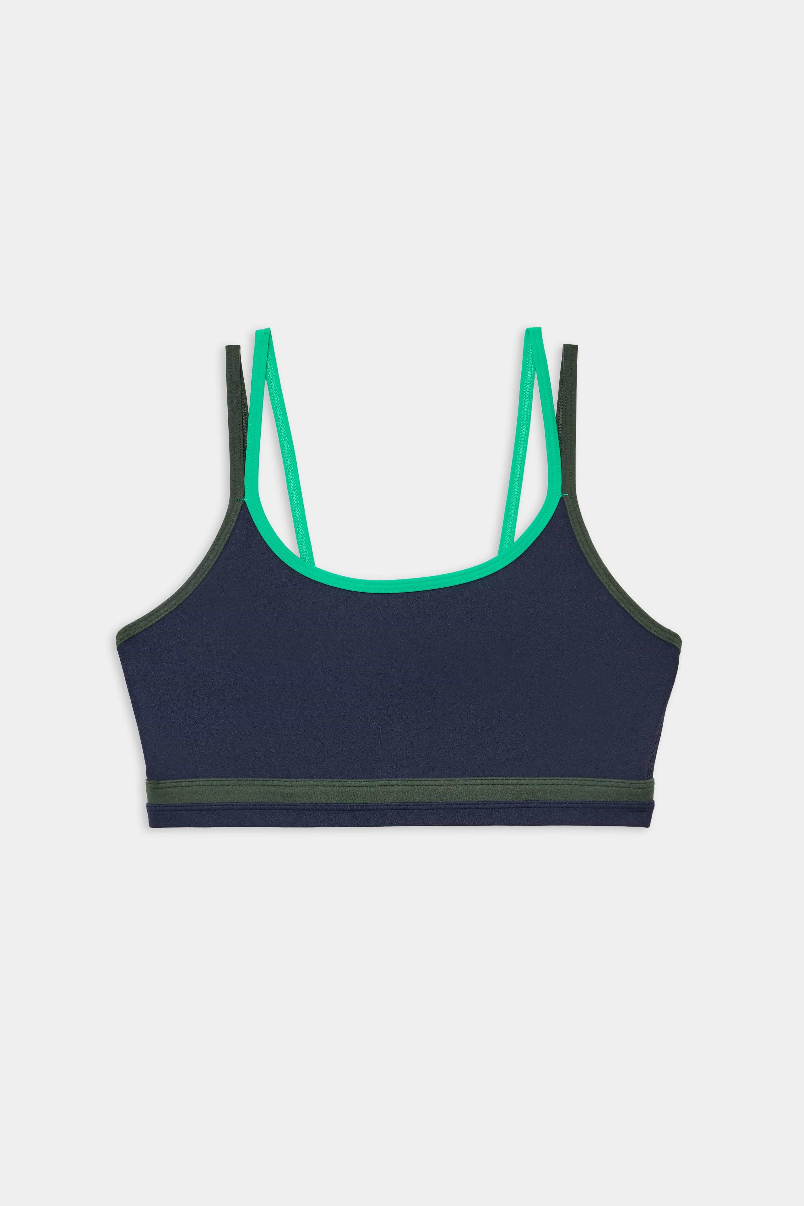 The SPLITS59 Eva Rigor Double Strap Bra in Indigo/Spearmint features double shoulder straps, green trim, and an elastic bottom band, shown on a white background.