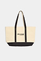Yellowish white tote bag with black bottom and straps