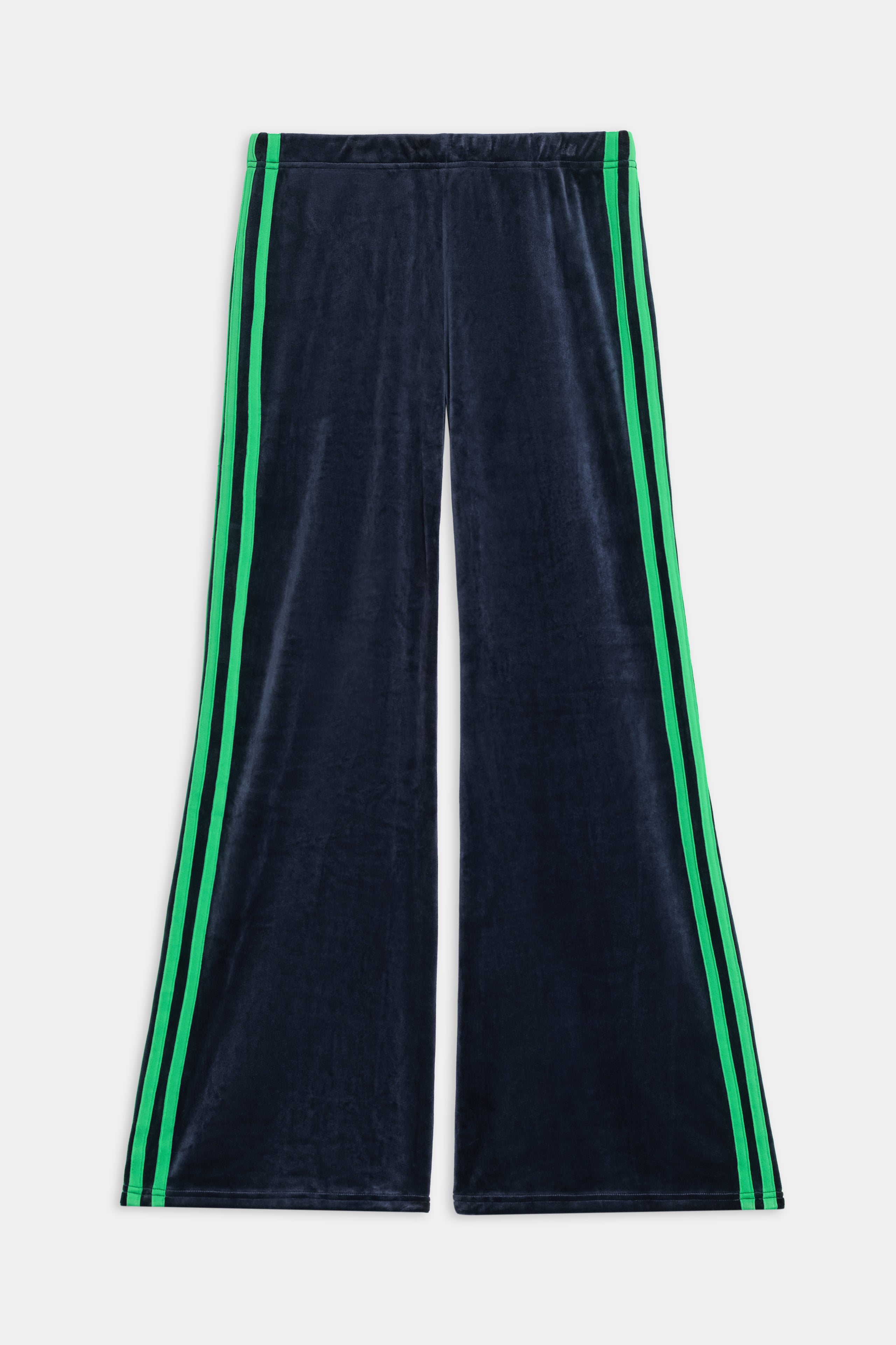 The SPLITS59 Heritage Velour Pant in Indigo/Grass features wide legs with two green side stripes, crafted from navy velour fabric and shown laid flat on a white background.