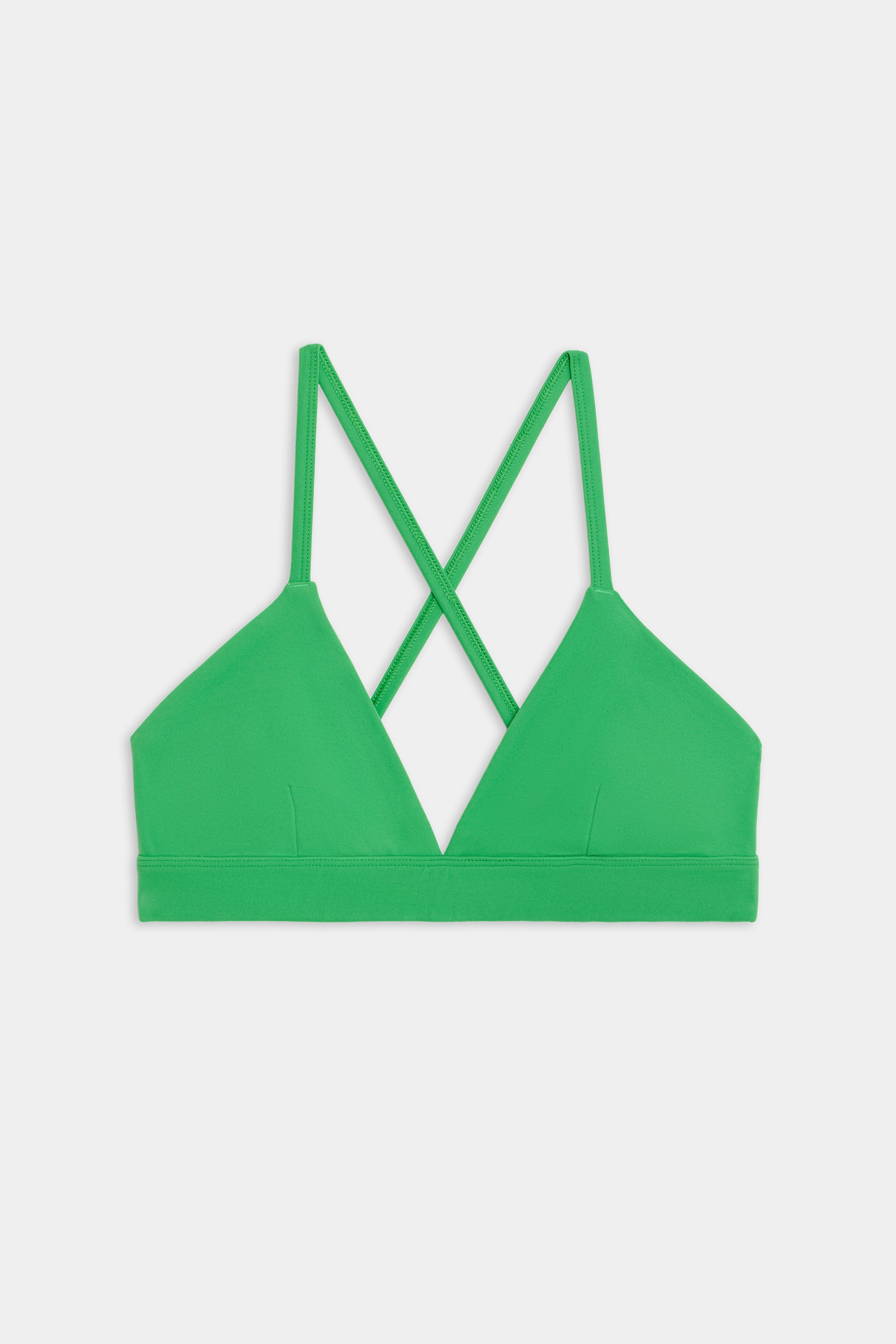 Theo Rigor Bra in Grass from SPLITS59, featuring crisscross straps and crafted from ultra luxe Rigor fabric, set against a plain background.