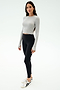 A person stands facing forward wearing the SPLITS59 Louise Rib Long Sleeve Crop in Heather Grey, paired with black leggings and white sneakers, against a plain white background.