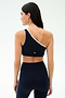 A woman wears the SPLITS59 Josie Airweight One Shoulder Bra in Indigo/White with matching high-waisted leggings, seen from the back against a light background—ideal activewear for Pilates or hot yoga.