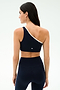 A woman wears the SPLITS59 Josie Airweight One Shoulder Bra in Indigo/White with matching high-waisted leggings, seen from the back against a light background—ideal activewear for Pilates or hot yoga.