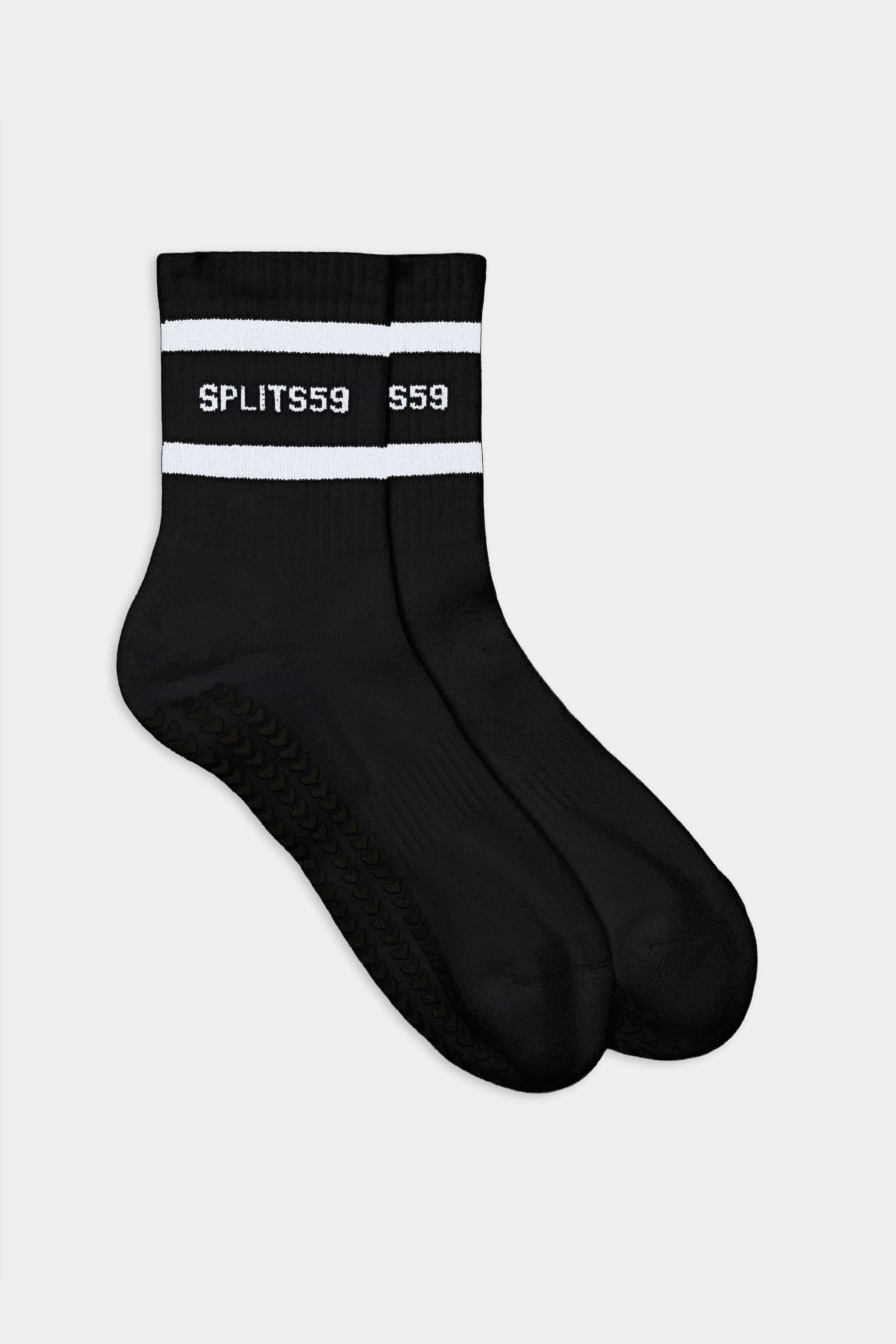 The SPLITS59 Logo Stripe Ankle Socks With Grip are black ankle socks featuring white stripes near the top and "SPLITS59" in white text.